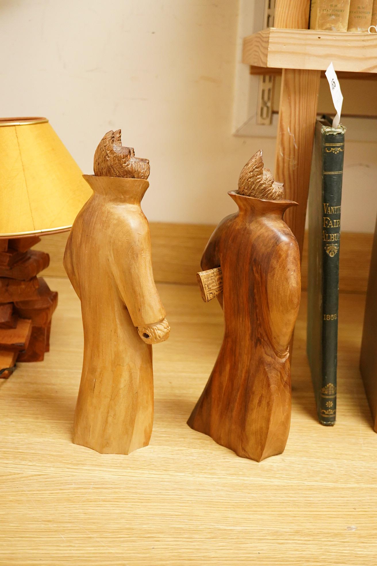 Pierre Decorse (b.1953), a pair of carved hardwood cats and a novelty lamp modelled as a stack of books, with shade, largest overall 36cm high